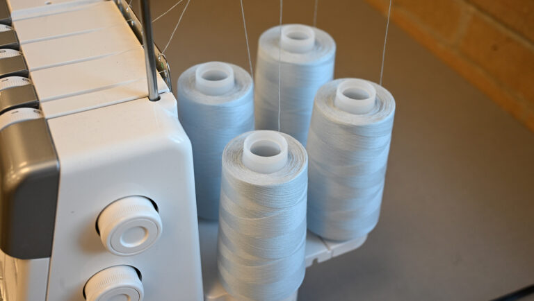 Overlock machine threaded and ready for garment construction.