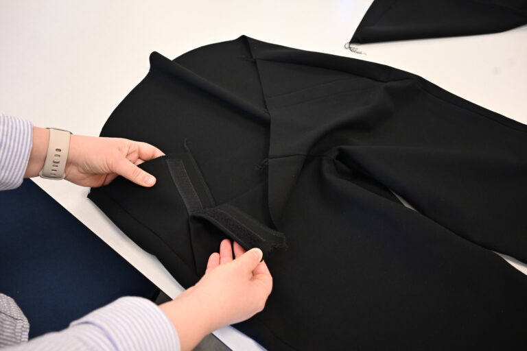 Attaching a hook-and-loop closure on a smart textile prototype.
