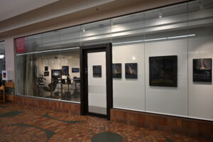 McMullen Gallery - storefront window, viewed from the corridor